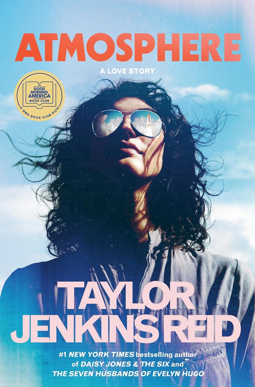 Book cover: "Atmosphere: A Love Story" by Taylor Jenkins Reid, featuring a person with sunglasses reflecting clouds and a rocket.