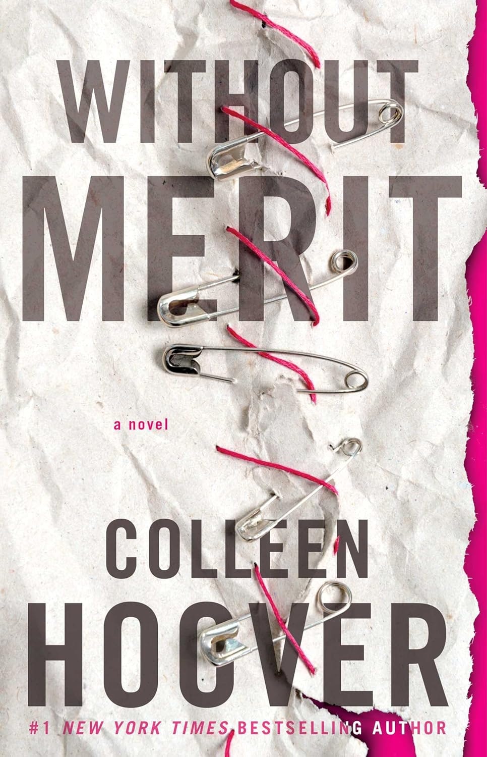 Book cover of "Without Merit" by Colleen Hoover with safety pins and red thread on crumpled paper.