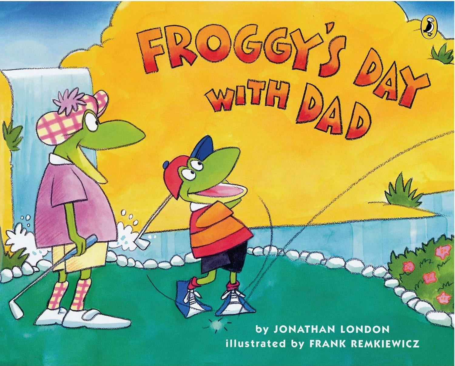Two cartoon frogs golf with the text "Froggy's Day With Dad" on a colorful background.