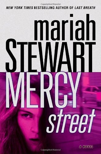 The image features the book "Mercy Street" by Mariah Stewart, with a bold design and a focus on a woman's face.