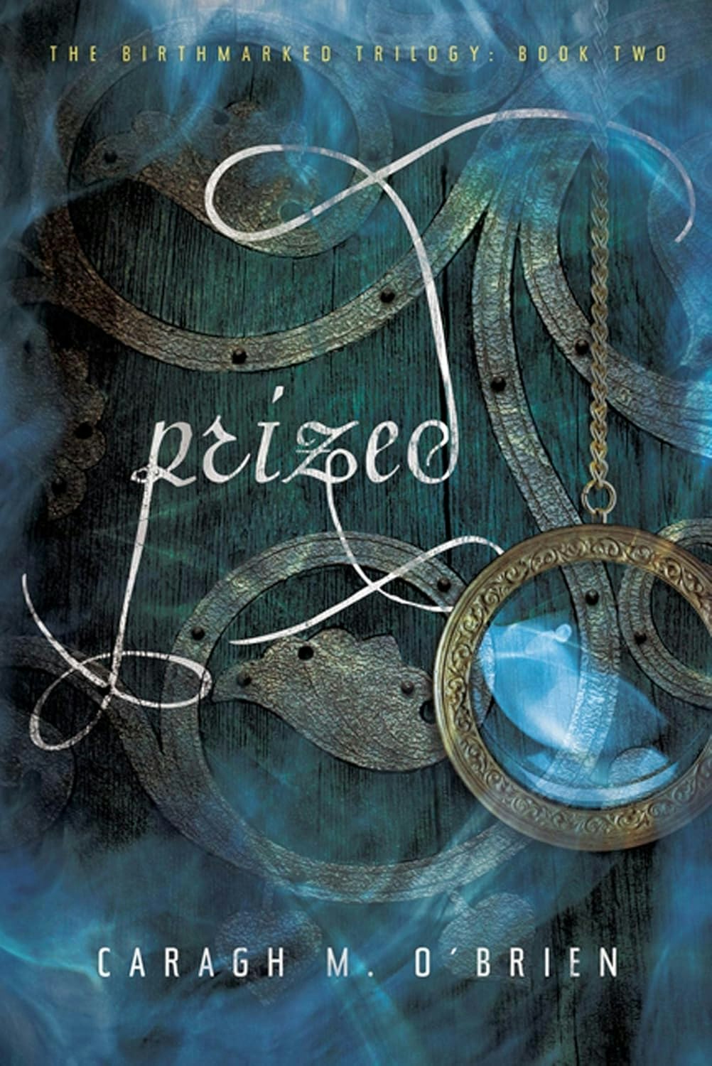 Book cover: "Prized" by Caragh M. O'Brien, part of The Birthmarked Trilogy, with a metal and glass design.