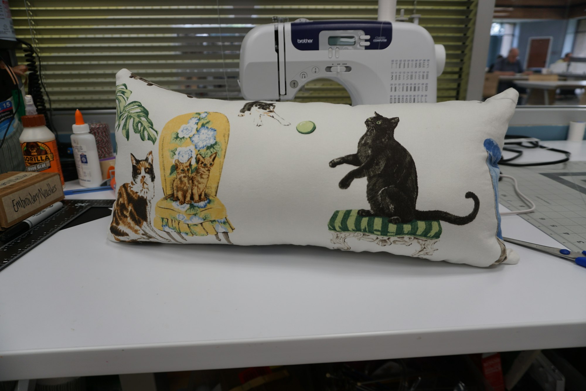 May contain: cushion, home decor, pillow, and person