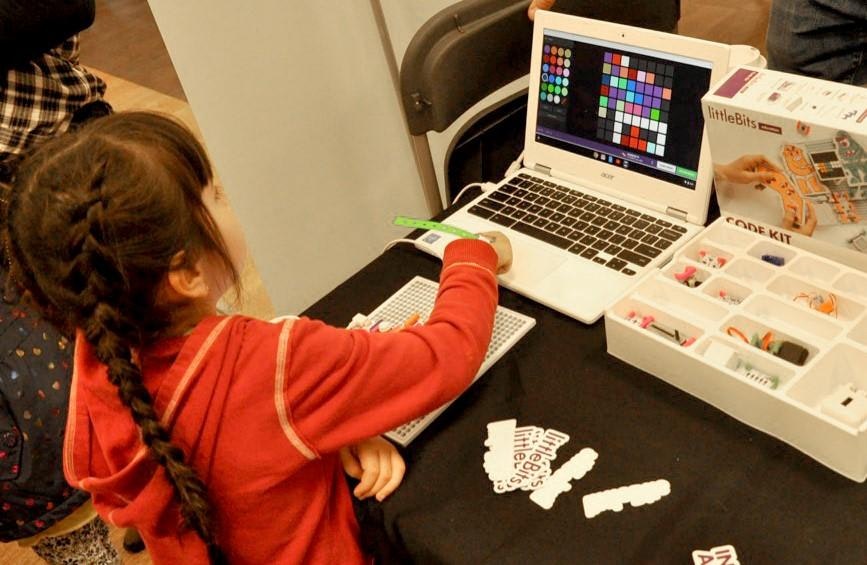 May contain: child, female, girl, person, computer, electronics, laptop, and pc
