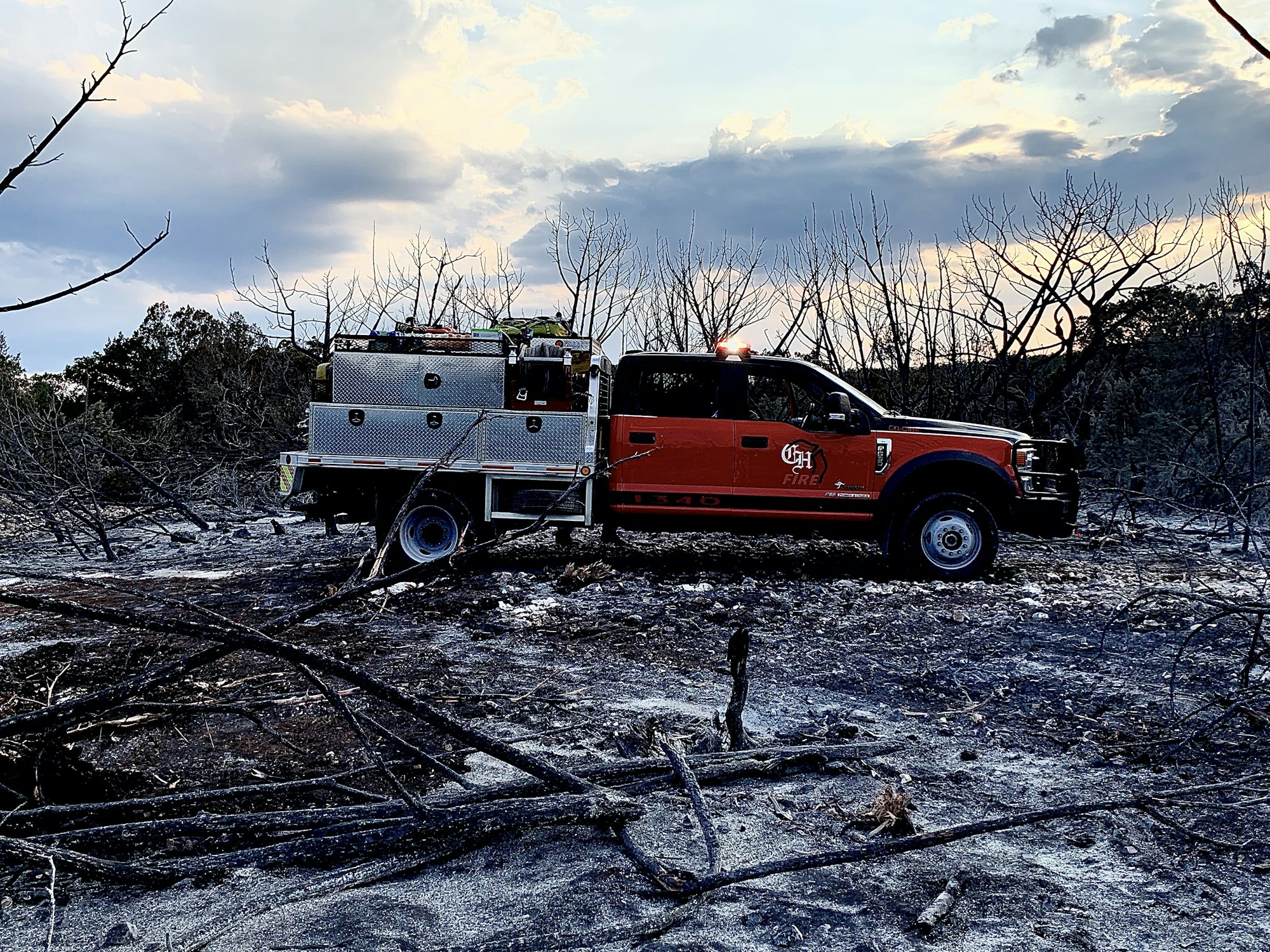 fire truck sitting in a burnt field