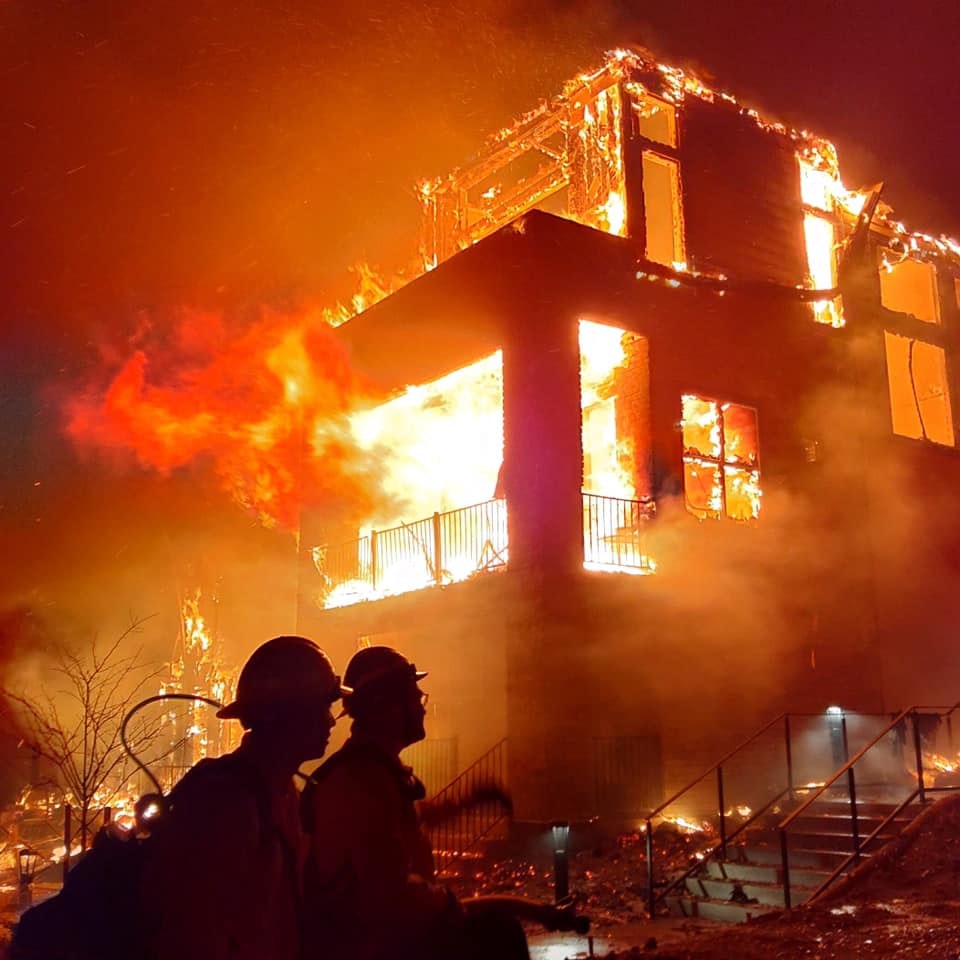 May contain: person, human, fire, and lighting