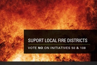 A sign urging to support local fire districts by voting no on initiatives 50 & 108, with a backdrop of flames.