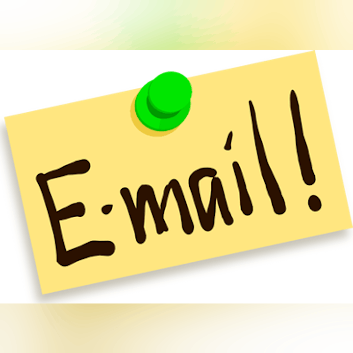 A note with "E-mail!" written on it, pinned by a green pushpin.