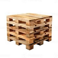 A stack of wooden pallets arranged in a square formation.
