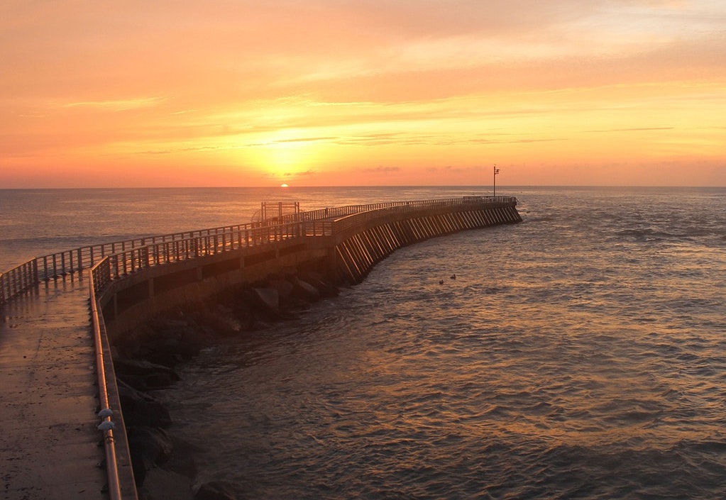 sunrise over the jetty and ocean