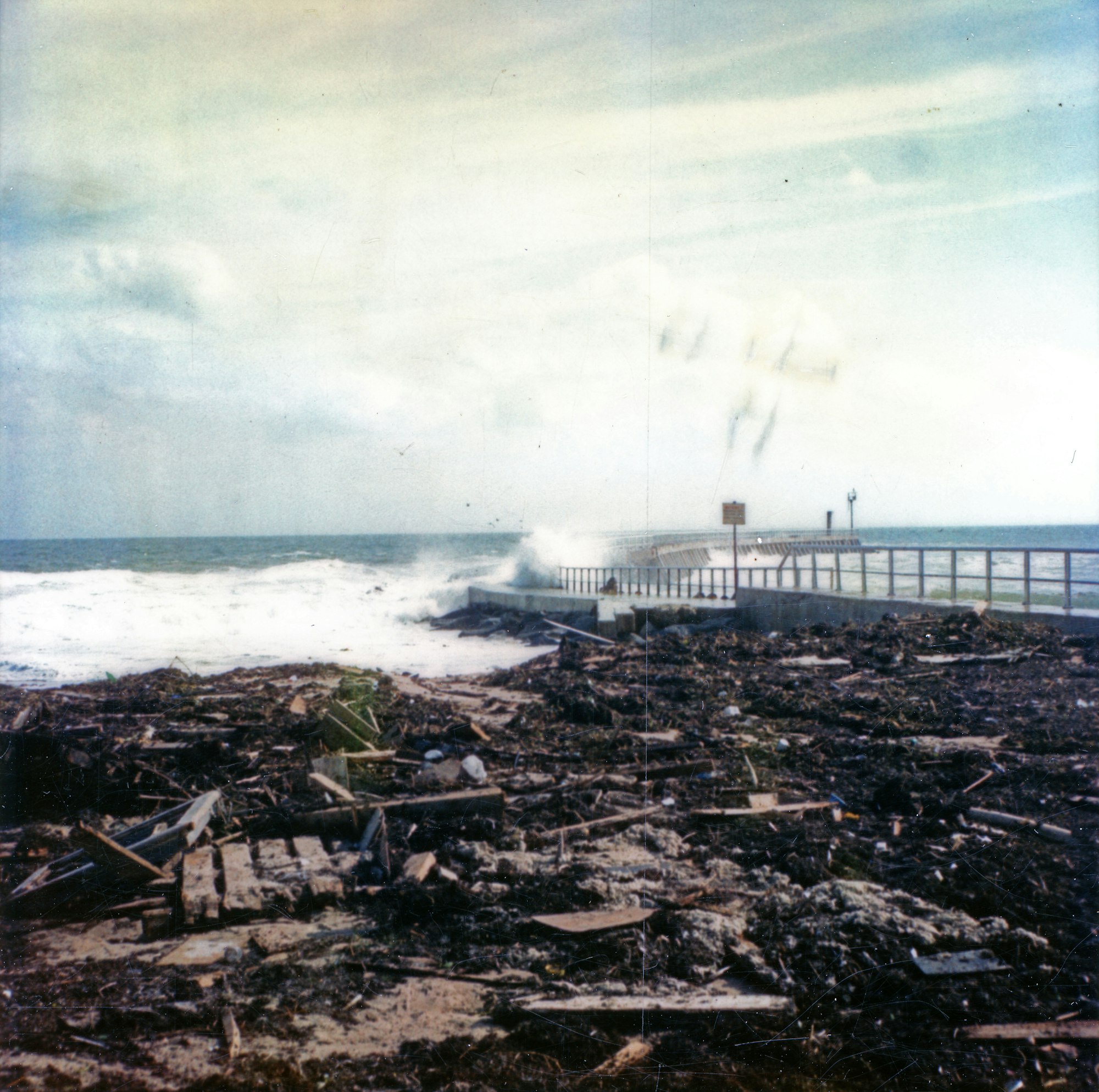 piles of debris washed ashore by the north jetty