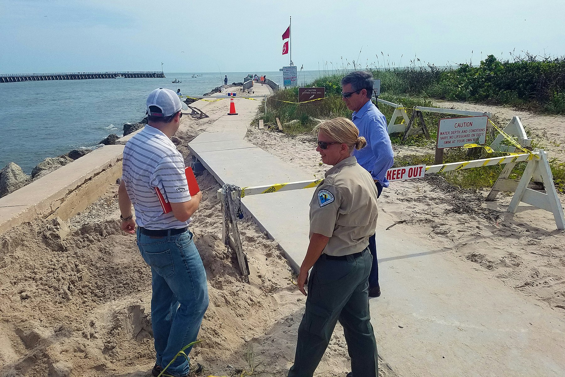 James Gray, Park Manager Jennifer Roberts and James Kershaw inspecting the base on the South Jetty