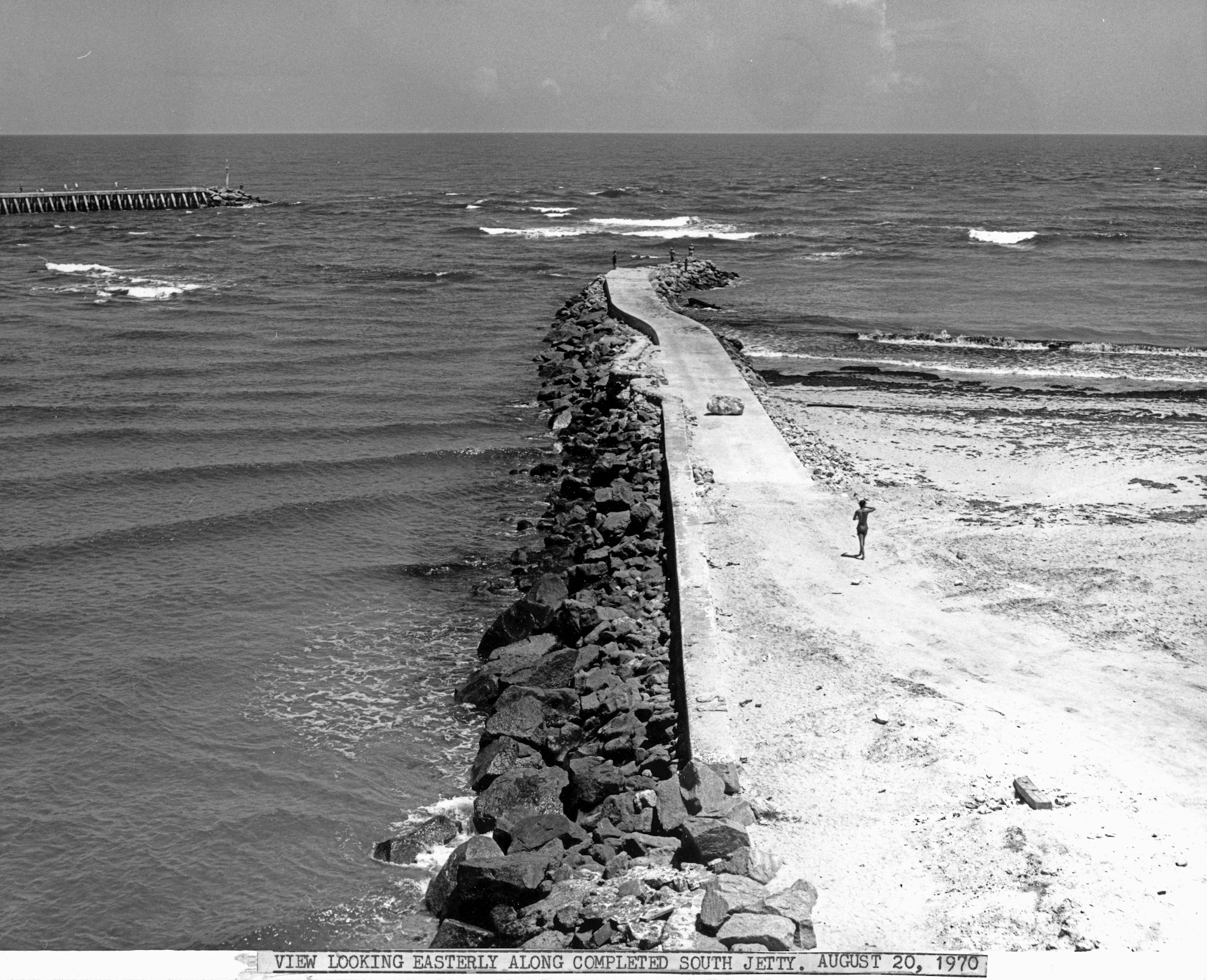 view of the completed South Jetty extending into the Atlantic Ocean