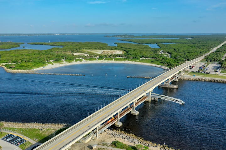 May contain: road, bridge, building, scenery, nature, outdoors, landscape, and freeway