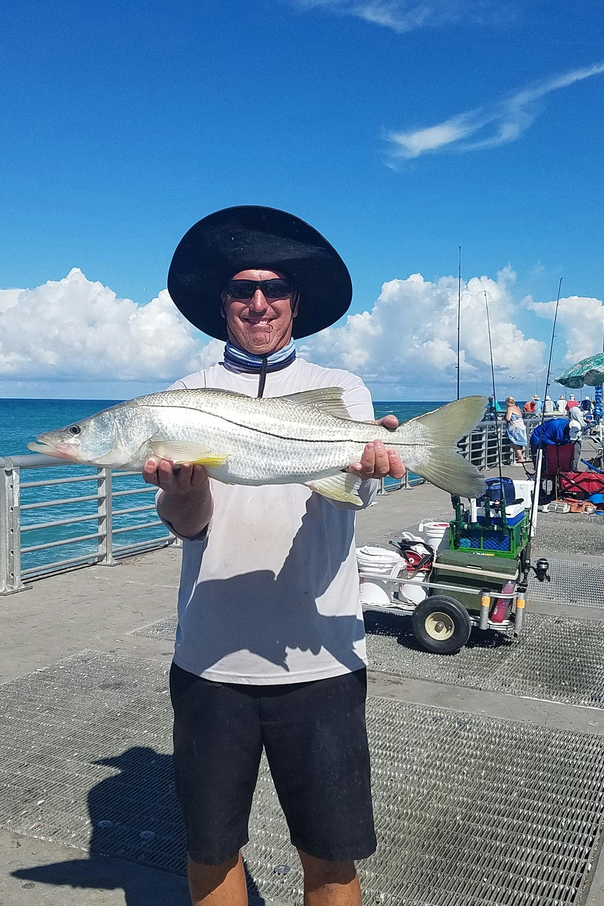 Man holding snook on North Jetty