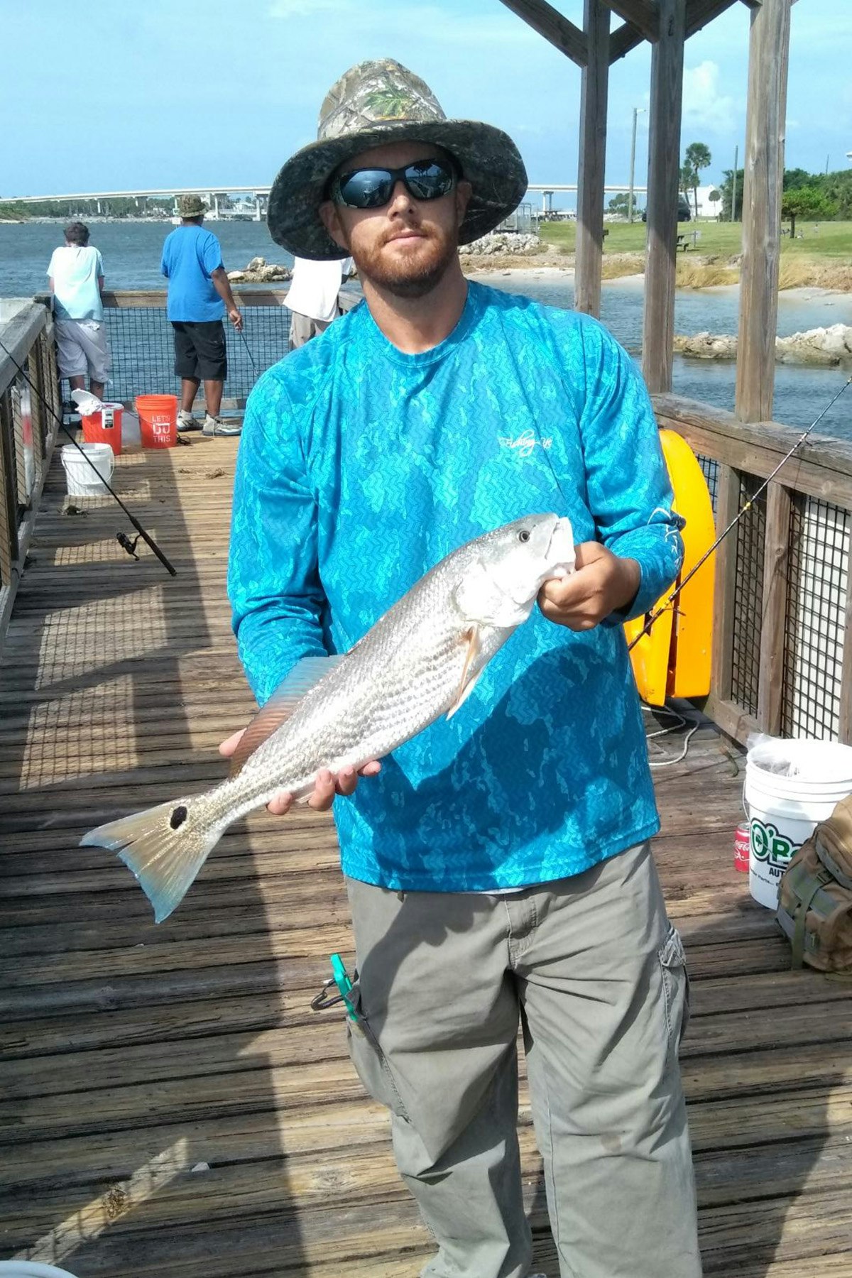 Fisherman holding a redfish