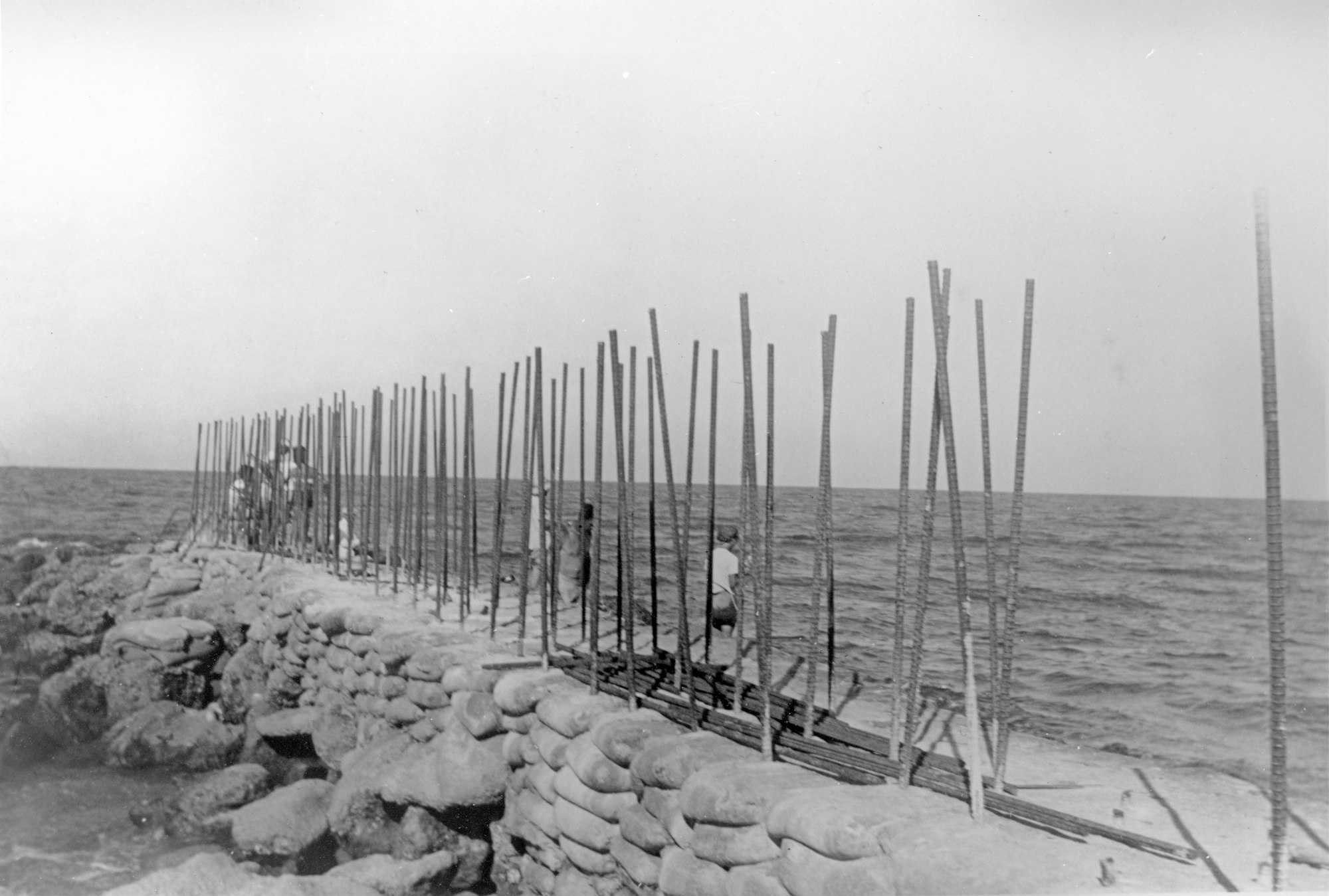 stacked concrete bags with rebar during jetty construction