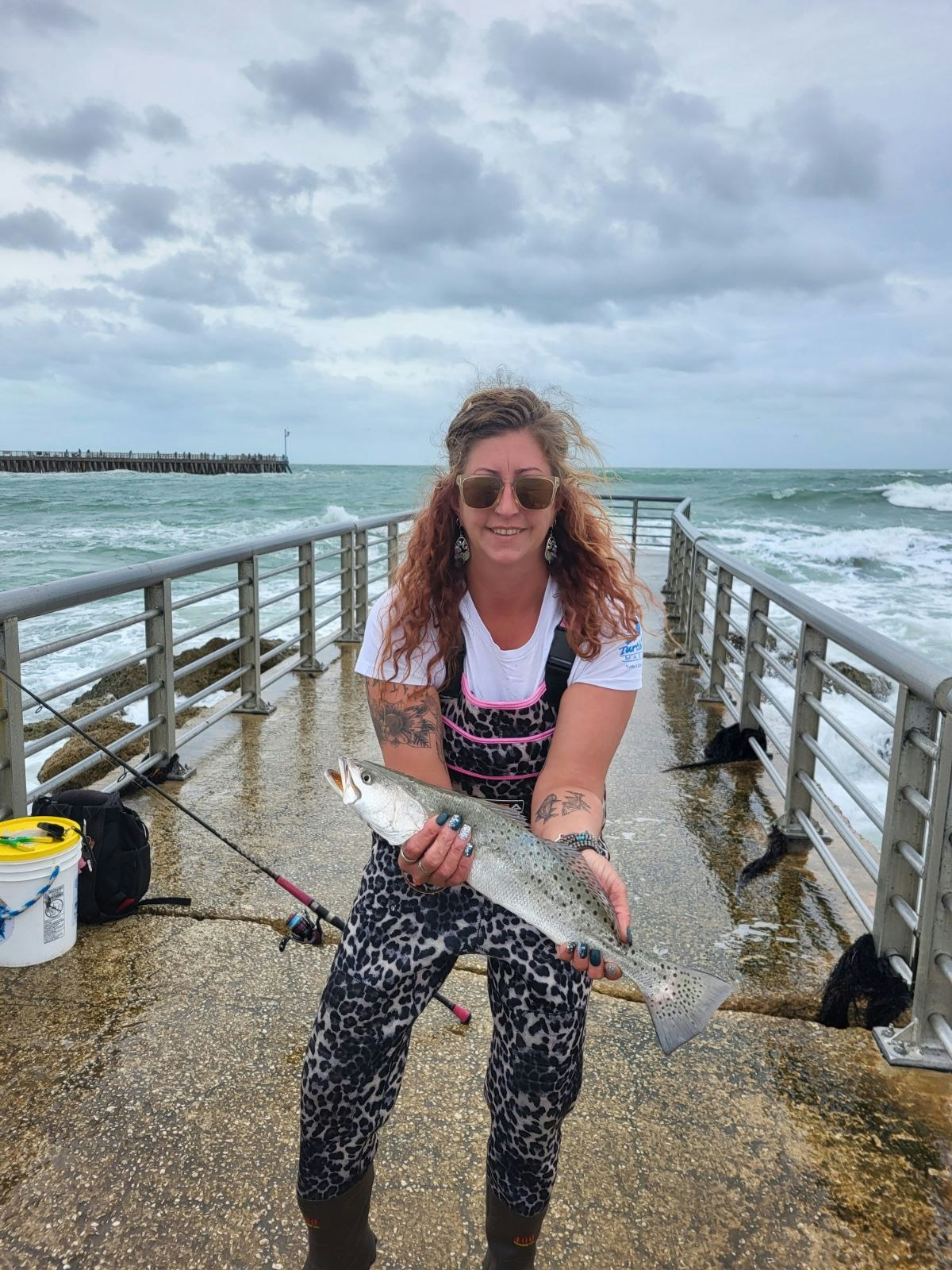 May contain: water, waterfront, face, head, person, photography, portrait, female, girl, teen, pier, animal, fish, sea life, outdoors, port, fishing, and leisure activities