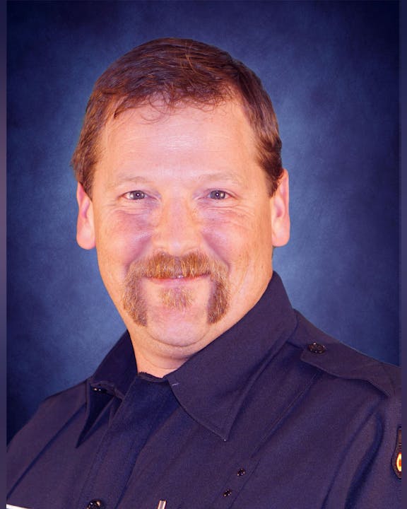 May contain: face, head, person, photography, portrait, adult, male, man, captain, officer, and mustache