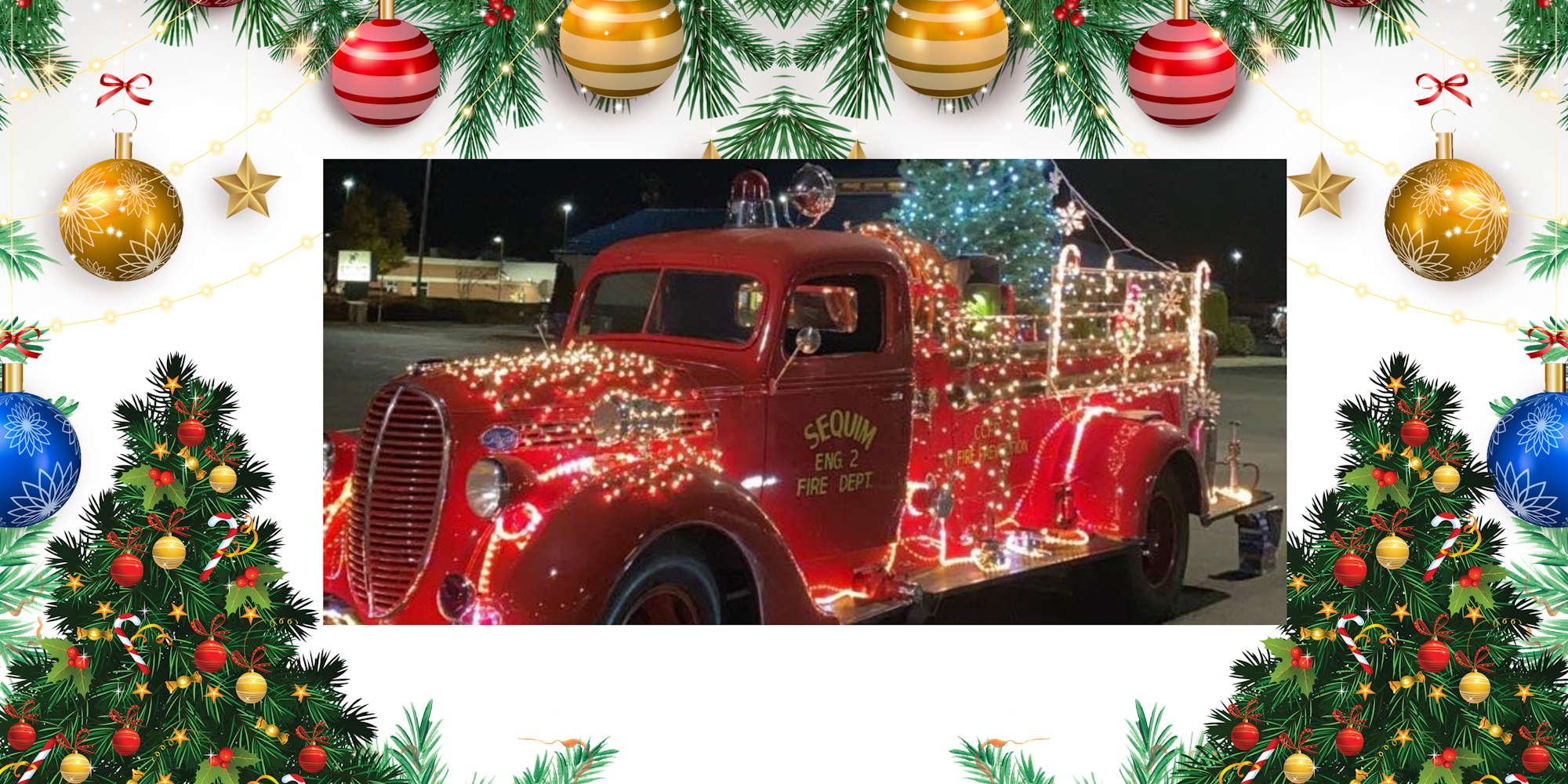 A festive fire truck adorned with Christmas lights and decorations.
