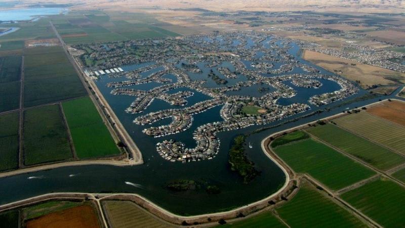 May contain: landscape, outdoors, nature, scenery, aerial view, water, dock, harbor, pier, waterfront, port, and panoramic