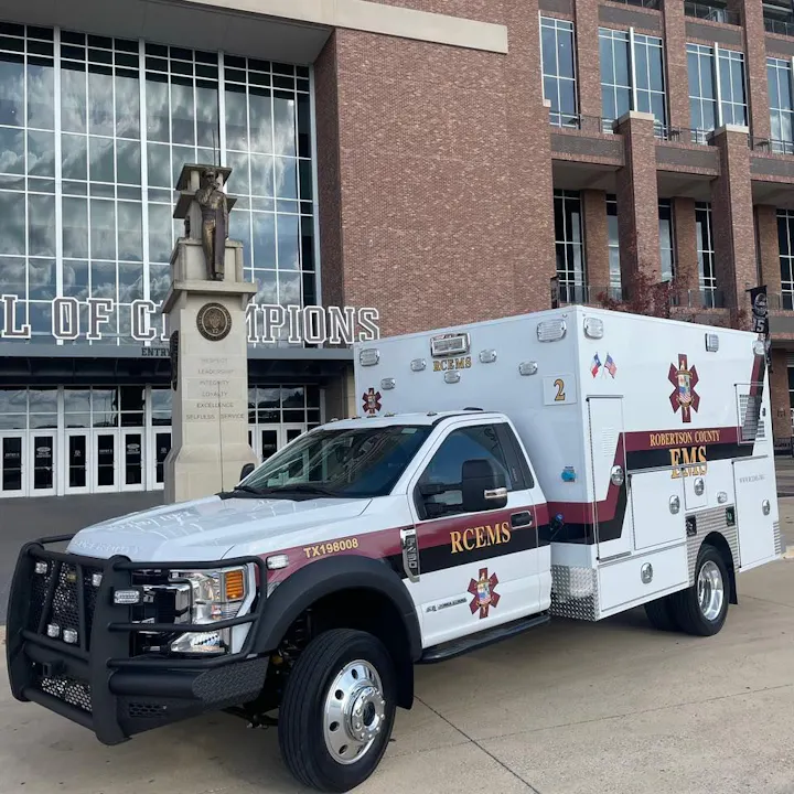 RCEMS ambulance in front of entrance to Kyle field