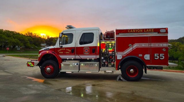 A fire truck at sunset with "Canyon Lake Fire / EMS" written on it.
