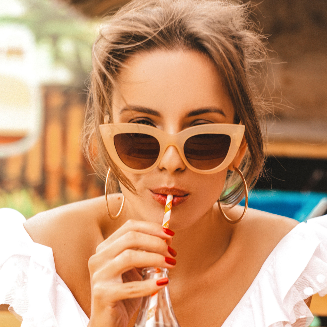 May contain: accessories, sunglasses, person, head, face, eating, and food