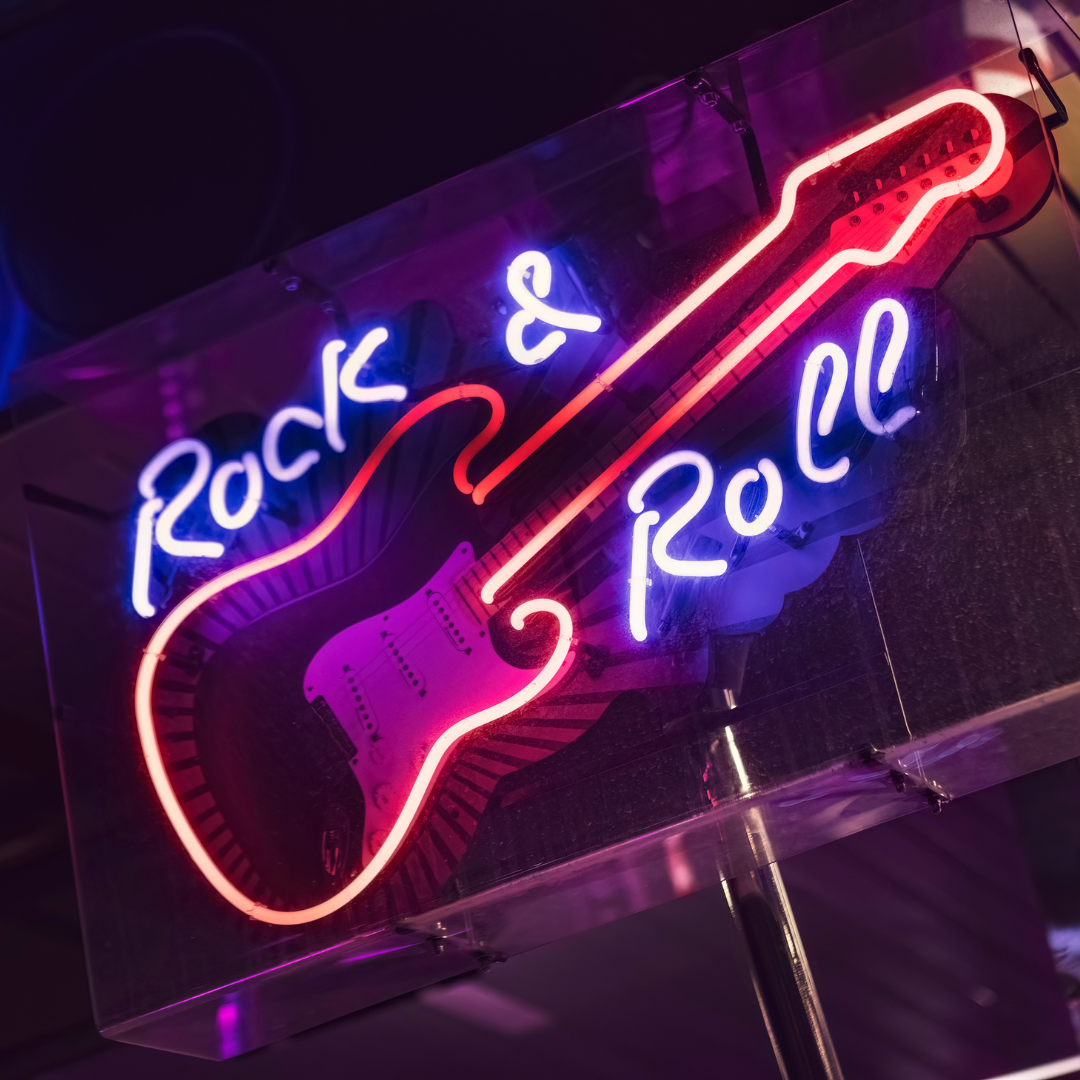 Neon sign with the words "Rock & Roll" and an electric guitar outline.