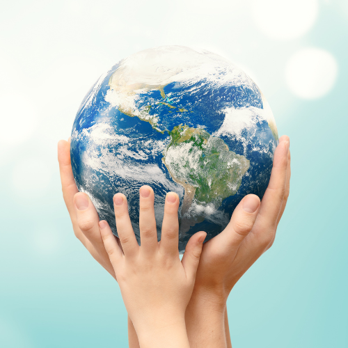 An image of hands, one adult and one child, holding a globe, symbolizing stewardship and care for the Earth.