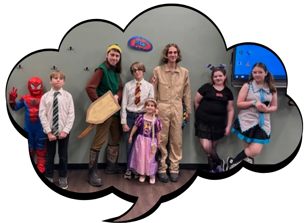 A group of kids in costumes, including superheroes and characters, posing together in a playful setting.