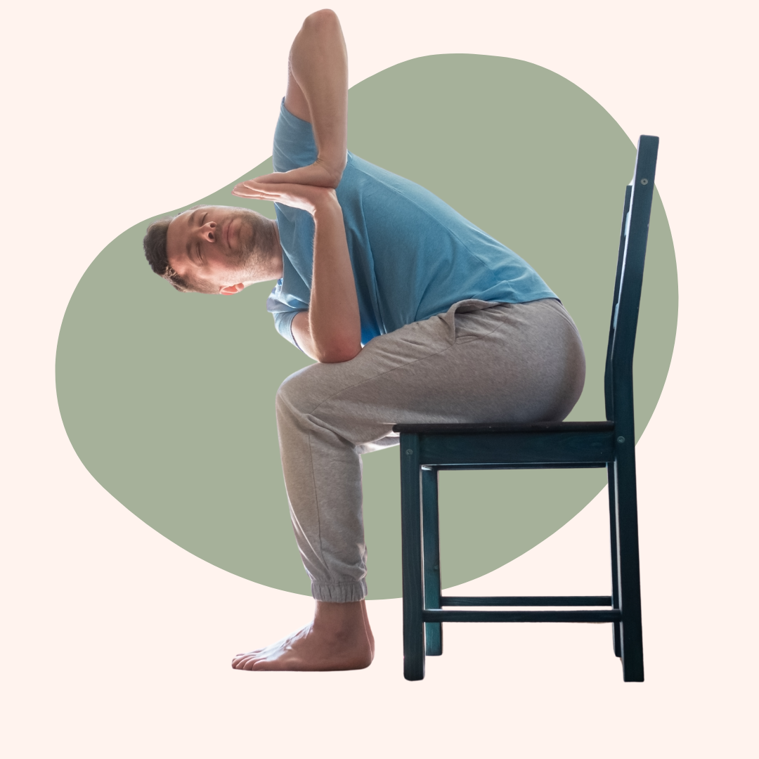Person in a seated twist yoga pose on a chair, in casual clothes.