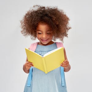 May contain: person, reading, child, female, and girl