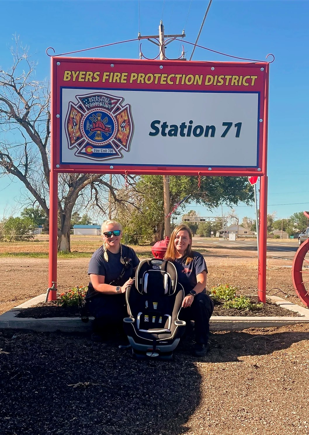 firefighters with car seat
