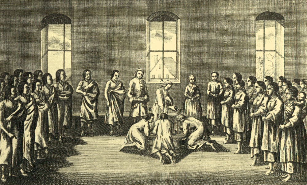 The image depicts a historical scene with a group of individuals observing a ceremony or activity in a large, open space.