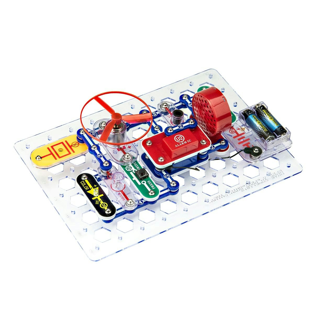 A snap circuit board with components like a fan, speaker, and batteries, used for educational electronic experiments.