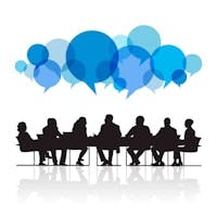 Silhouettes of people seated around a table with colorful speech bubbles above, symbolizing discussion or brainstorming.