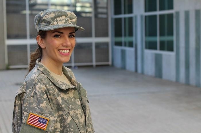 smiling woman in military clothes