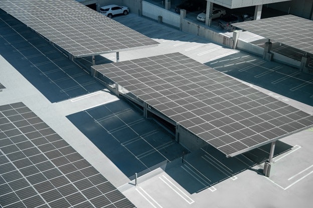 A parking lot covered with solar panels, providing shade and generating renewable energy.