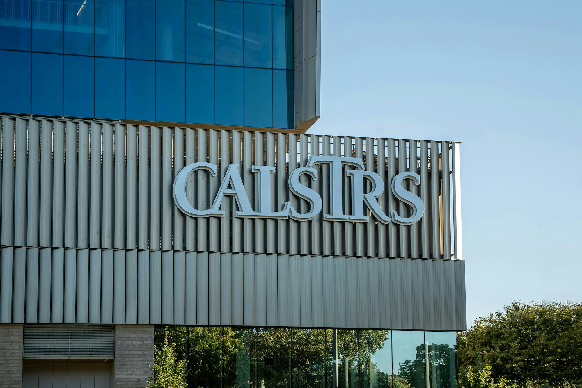 The image shows a building with the sign "CALSTRS" on its facade.