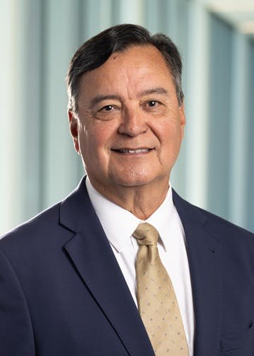 Steve Juarez in a suit and tie.