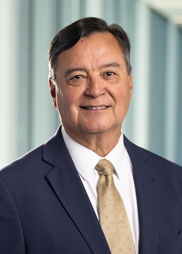 Steve Juarez in a suit and tie.