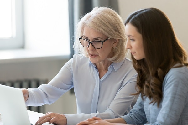 Two women using a computer