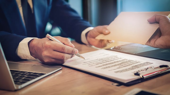 Man signing a contract