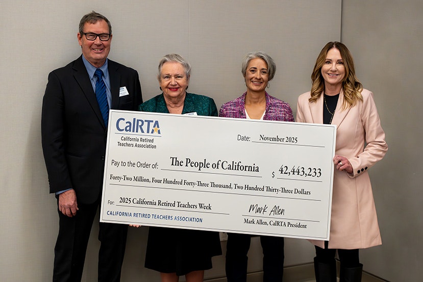 A group holds a large check from the California Retired Teachers Association for over $42 million for "The People of California."