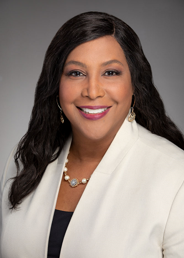 Former deputy chief investment operating officer Debra Smith. She wears a white jacket.