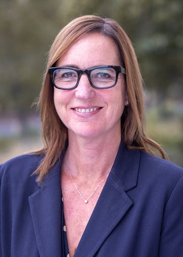 CalSTRS board member Sharon Hendricks wears glasses, blue blazer.
