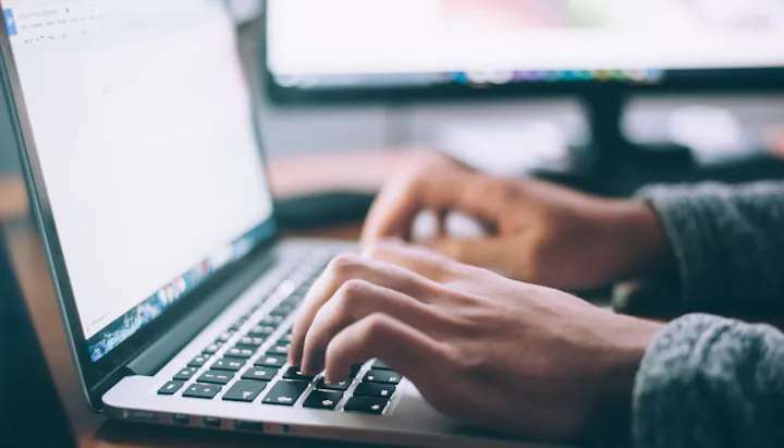 Woman's hands using a laptop