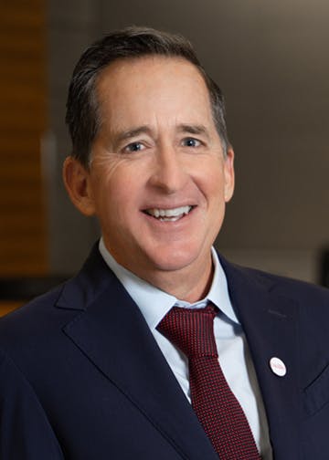 CalSTRS board member Harry Keiley wears a blue blazer and tie.