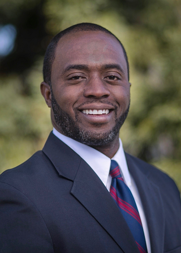 Superintendent of Instruction Tony Thurmond wears a blazer and tie.