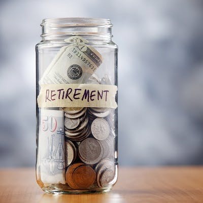 Jar of coins labeled "Retirement"